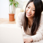 beautiful asian woman using a laptop computer